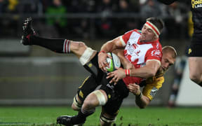 The Hurricanes' Brad Shields tackles the Lions Jaco Kriel in the Super Rugby Final, Hurricanes v Lions, Westpac Stadium, Wellington, Saturday, August 06, 2016.