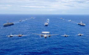 Aircraft from the Carl Vinson Carrier Strike Group (VINCSG) and French Carrier Strike Group (CSG) fly in formation over the Philippine Sea with ships from VINCSG, French CSG, the Japan Maritime Self-Defense Force (JMSDF), and U.S. Military Sealift Command (MSC) during #PacificSteller2025,