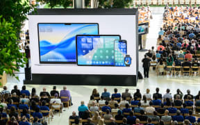 Apple announces a new design language for its operating systems called "Liquid Glass" during the annual Apple "Worldwide Developers Conference" (WWDC) at Apple Park, the corporate headquarters of Apple Inc., in Cupertino, California on June 9, 2025. Pressure is on Apple to show it hasn't lost its magic despite broken promises to ramp up iPhones with generative artificial intelligence (GenAI) as rivals race ahead with the technology. Apple will showcase plans for its coveted devices and the software powering them at its annual Worldwide Developers Conference (WWDC) kicking off Monday in Silicon Valley and running through June 13. (Photo by Josh Edelson / AFP)