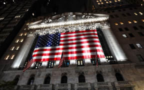 A view of the New York Stock Exchange in Wall Street with US national flag on Election Day.
