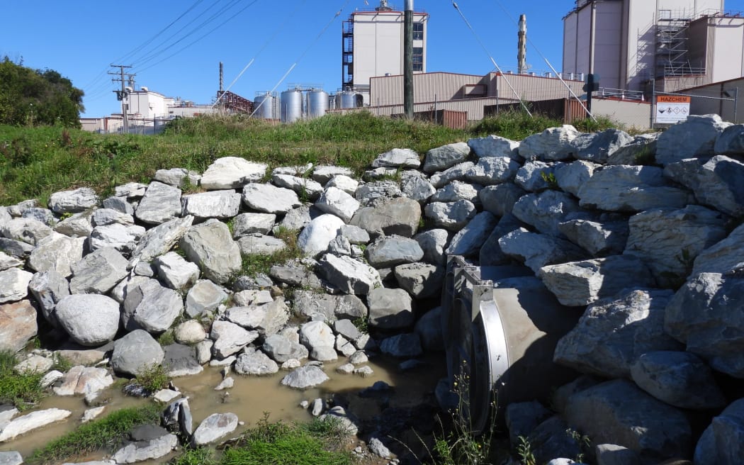The Westland District Council stormwater outfall through the current Hokitika River protection wall, to the rear of Westland Milk Products, is considered a factor in the increasingly vulnerable line of defense between the river, the factory, and the surrounding residential area.