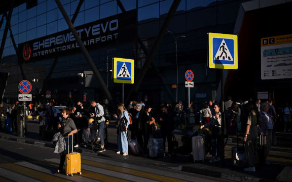 Passengers wait for their taxis at Moscow's Sheremetyevo International Airport on September 14, 2023. (Photo by Natalia KOLESNIKOVA / AFP)