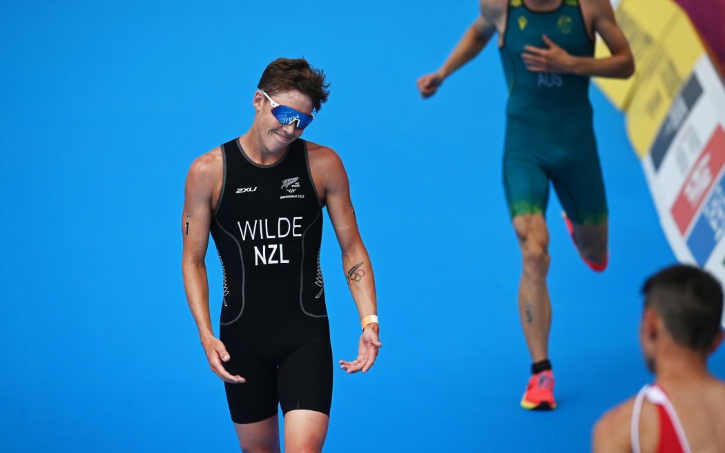 New Zealand's Hayden Wilde after a 10 second penalty as England's Alex Yee wins the race.