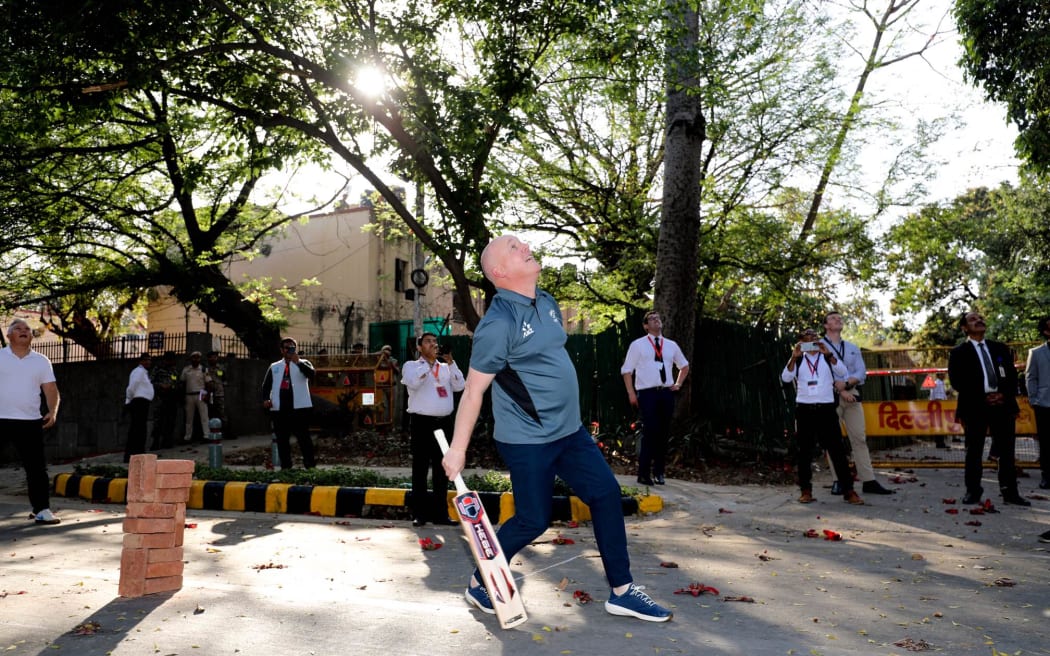 Luxon plays cricket with Kapil Dev in New Delhi, India on 19 March 2025.
