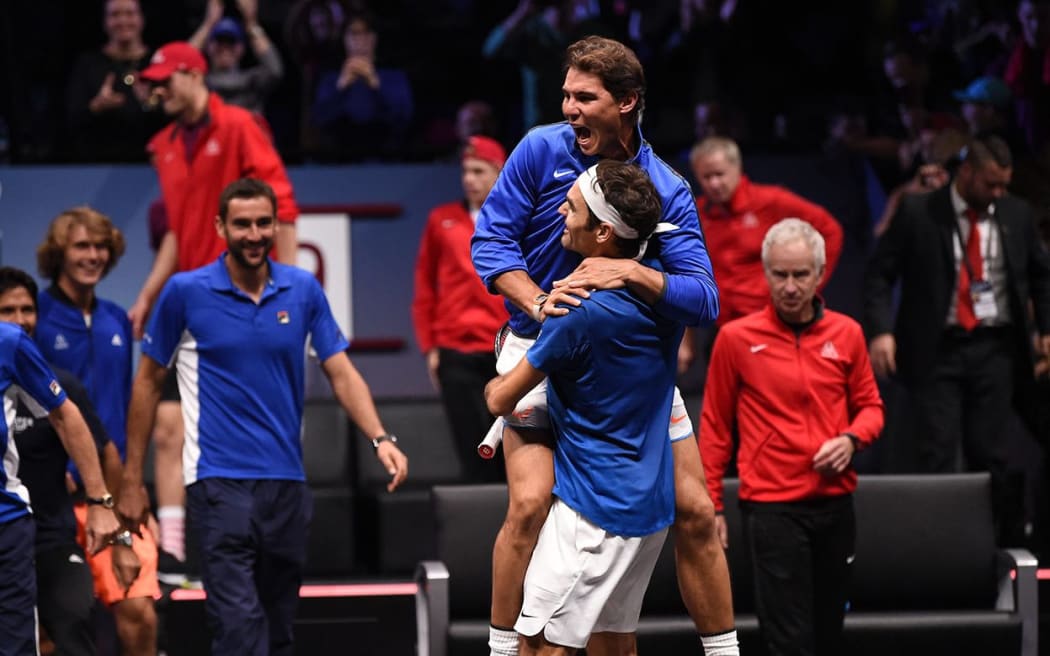 Rafa Nadal celebrates Roger Federer's victory