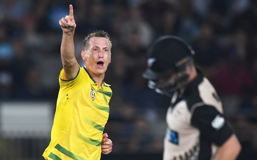 South Africa's Chris Morris celebrates the dismissal of Colin Monroe.