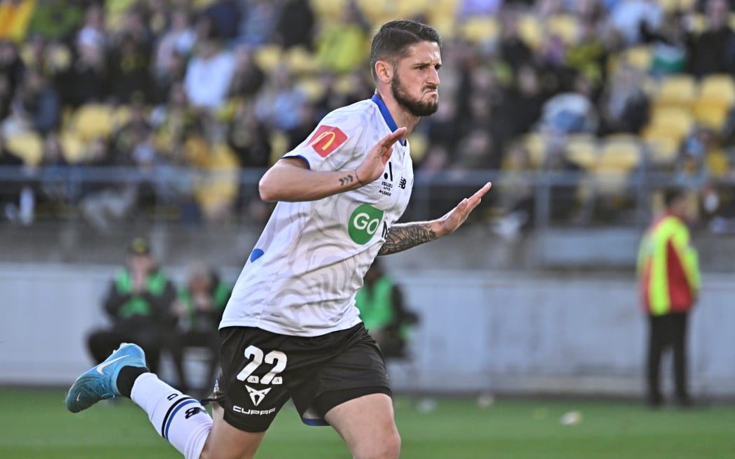 Jake Brimmer celebrates one of his two goals for Auckland FC against Wellington Phoenix in Wellington.