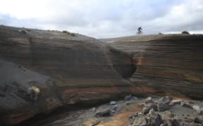 Mountain biking on the Tukino Skifield access road.