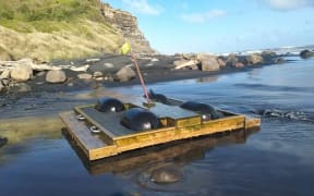 The pontoon from Quinney's Bush Camp, south of Nelson, washed up the Motupiko River and floated up the sea to South Taranaki