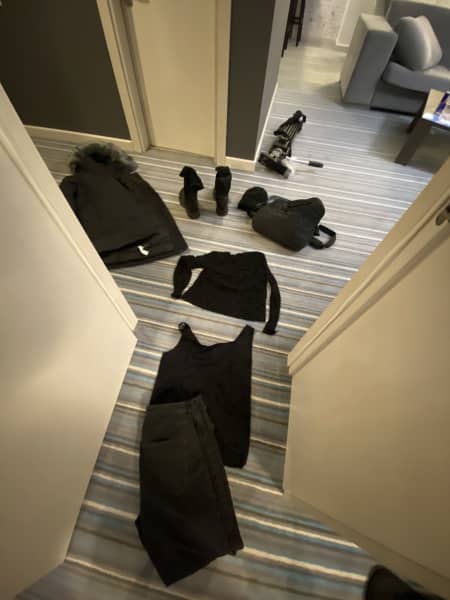 Lisette Reymer's clothes laid out on the floor for bomb shelter run.