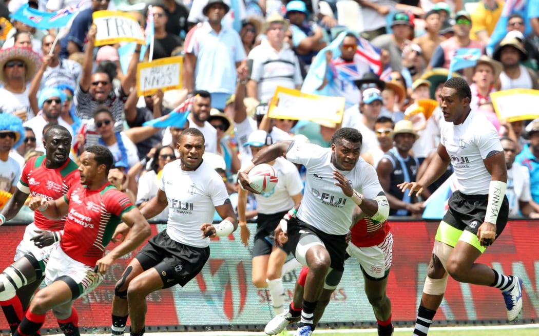 Savenaca Rawaca finds open space against Kenya, with a large Fijian support base behind him.