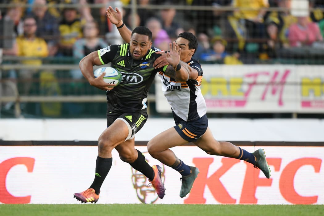 Hurricanes Ngani Laumape breaks a tackle to score a try.