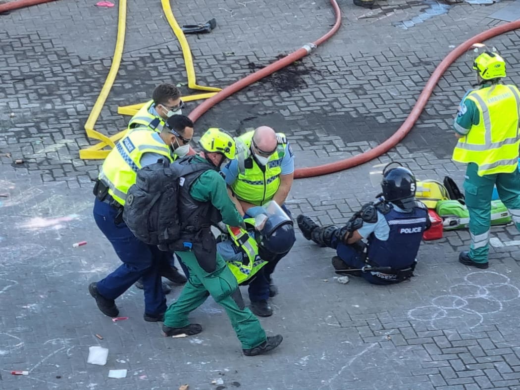 Several police appear to be injured.