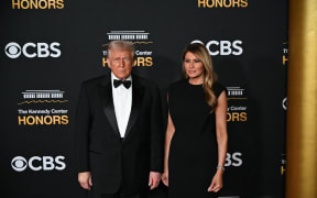 US President Donald Trump and First Lady Melania Trump arrive for the 48th Kennedy Center Honors gala at the Kennedy Center in Washington, DC, on December 7, 2025. (Photo by Alex WROBLEWSKI / AFP)