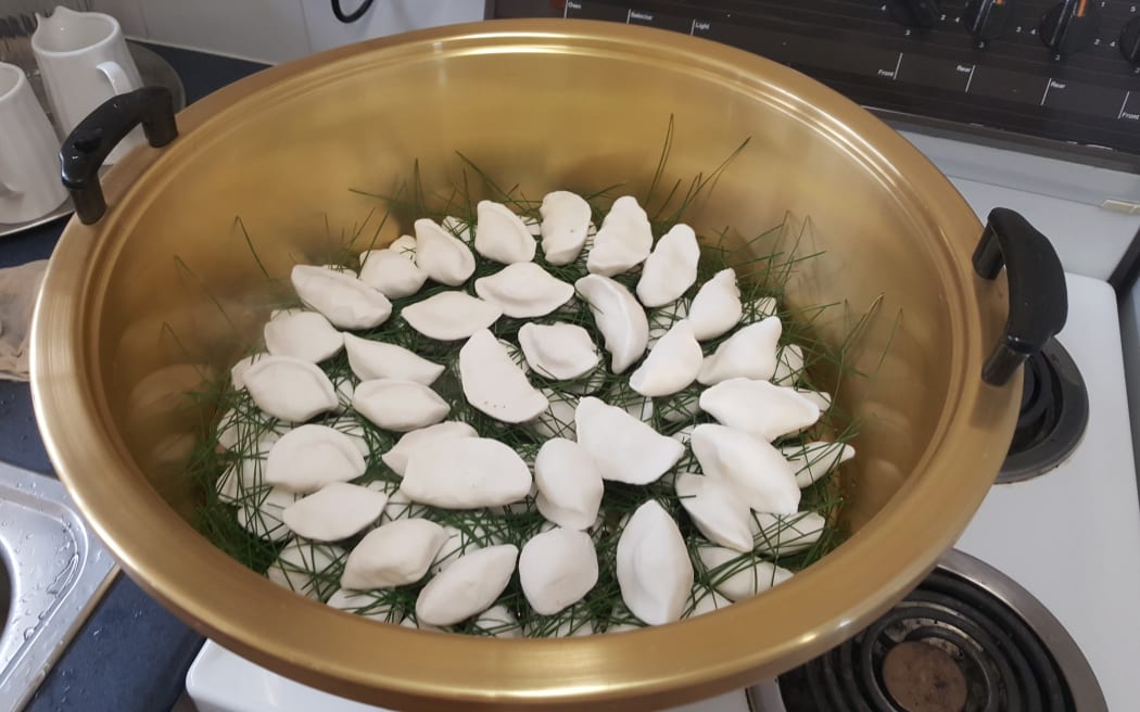 Koreans eat half-moon rice cakes songpyeon to celebrate Chuseok.