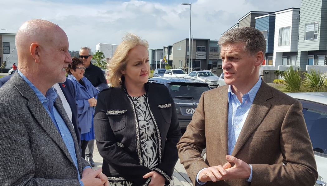 Bill English (right) at the Hobsonville housing development with Social Housing minister Amy Adams (centre) and real estate salesperson Mike Pearce (left).