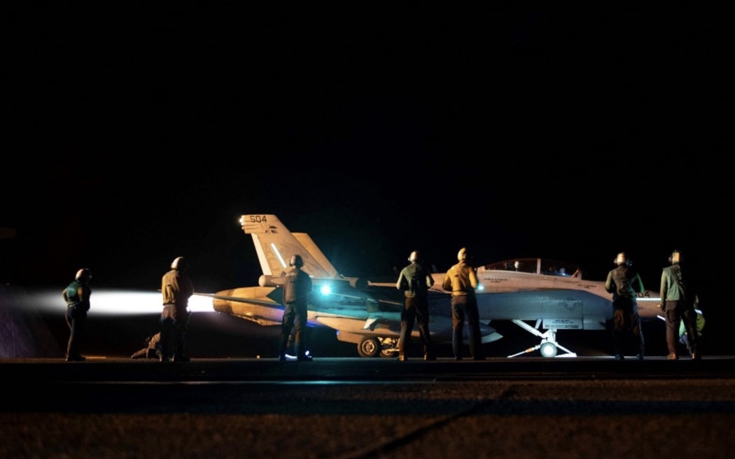 In this photo released by the US military's Central Command on February 3, 2024, US Central Command forces, alongside UK Armed Forces and with the support from Australia, Bahrain, Canada, Denmark, the Netherlands, and New Zealand conducted strikes against 36 Huthi targets at 13 locations in Iranian-backed Huthi-controlled areas of Yemen. These multilateral coalition strikes focused on targets in Huthi-controlled Yemen used to attack international merchant vessels and US Navy ships in the region. (Photo by US Central Command (CENTCOM) / AFP) / RESTRICTED TO EDITORIAL USE - MANDATORY CREDIT "AFP PHOTO /  HANDOUT / CENTCOM " - NO MARKETING - NO ADVERTISING CAMPAIGNS - DISTRIBUTED AS A SERVICE TO CLIENTS