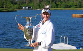 Nelly Korda of the United States celebrates with the trophy after winning The Chevron Championshipin Texas, 2024.