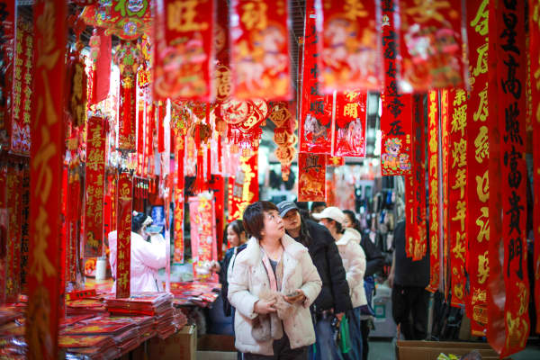 People buy decorations in preparation for Spring Festival, the week-long holiday that marks the beginning of the Lunar New Year, at a market in Shenyang, in China’s northeast Liaoning province on February 4, 2026. The Year of the Horse begins on February 17.