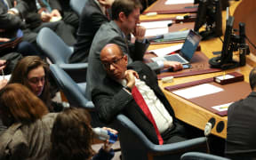 US Deputy Ambassador to the UN Robert Wood talks with his advisors during a UN Security Council at UN headquarters in New York.