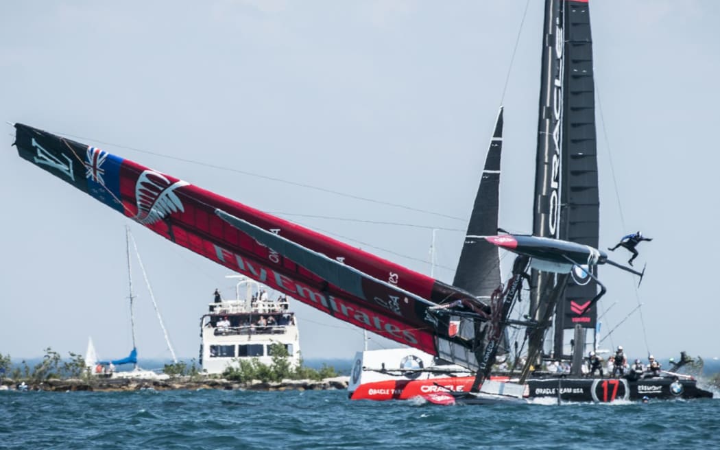 Team New Zealand capsizes on Lake Michigan.