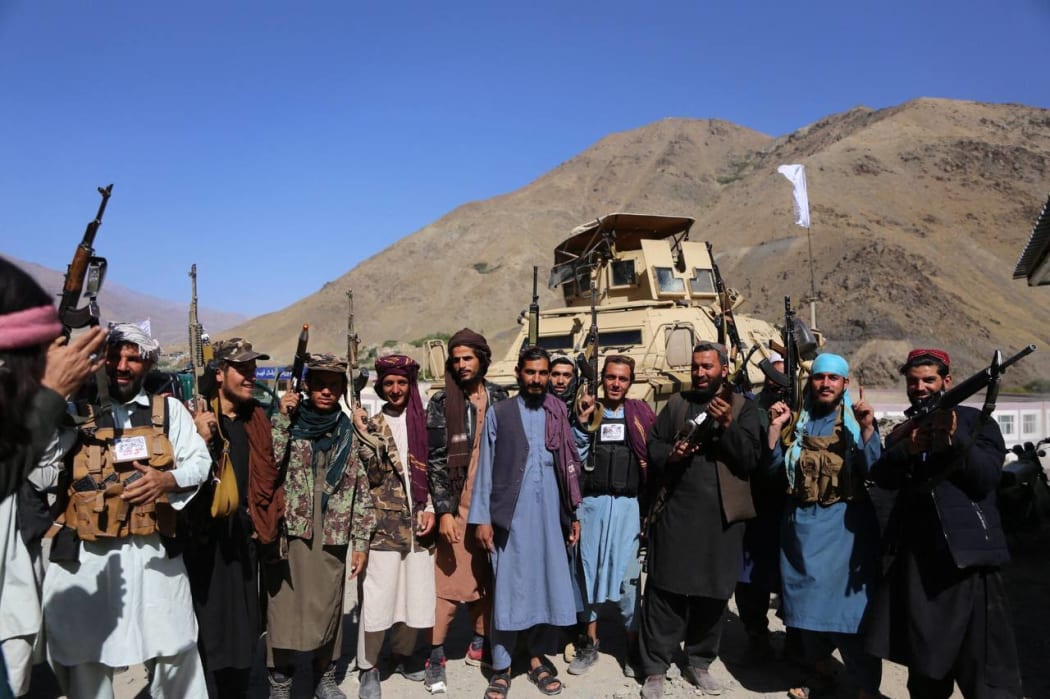Taliban members pose for a photo after they took over Panjshir Valley, the only province the group had not seized during its sweep last month in Afghanistan on September 6, 2021.