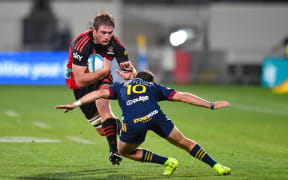 Ethan Blackadder of the Crusaders is tackled by Mitch Hunt of the Highlanders  during the Super Rugby Pacific match, Crusaders Vs Highlanders, at Orangetheory Stadium, Christchurch, New Zealand, 1st April 2022. Copyright photo: John Davidson / www.photosport.nz