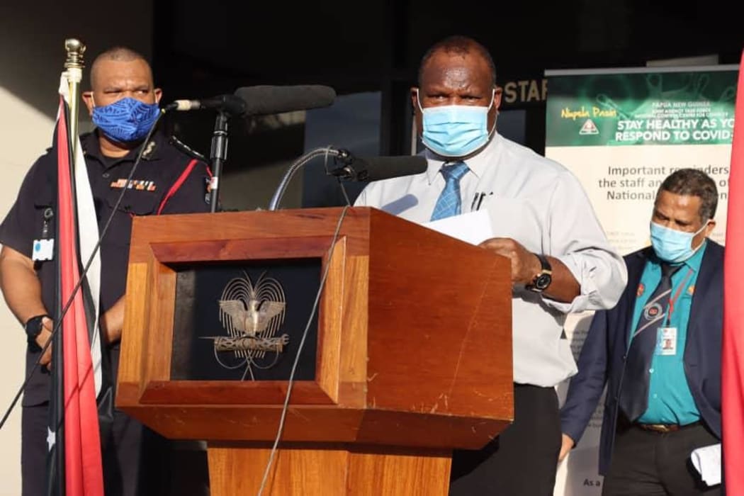 PNG's Pandemic Response Controller David Manning (left), Prime Minister James Marape (centre) and Acting Health Secretary Paison Dakulala (right).