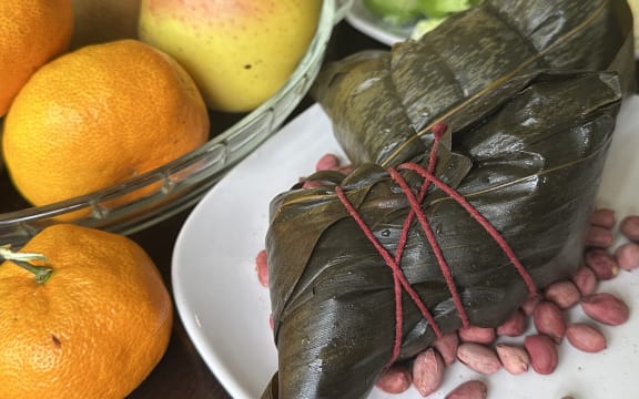 A traditional Chinese sticky rice dumpling filled with pork and salted egg yolk.