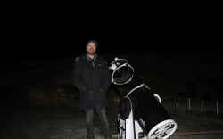 Tour guide and business manager Sam Blair with a Dobsonian telescope.