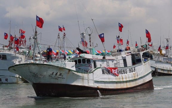 Taiwanese fishing boats are seen departing to Taiping island, part of the disputed Spratly Islands chain in the South China Sea.