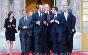 Finland's Prime Minister Sanna Marin (L), Cyprus' President of the Republic Nicos Anastasiades (2nd L), President of the European Council Charles Michel (3rd L0, France's President Emmanuel Macron (2nd R), Romania's President Klaus Werner Iohannis (R) and EU leaders arrive to pose for a family photograph at the Palace of Versailles, near Paris, on March 10, 2022, prior to the EU leaders summit to discuss the fallout of Russia's invasion in Ukraine. - EU leaders are scrambling to find ways to urgently address the fallout of Russia's invasion of Ukraine that has imperilled the bloc's economy and exposed a dire need for a stronger defence. (Photo by Ludovic MARIN / AFP)