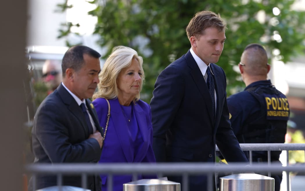 WILMINGTON, DELAWARE - JUNE 03: First lady Jill Biden, joined by Peter Neal (R) arrives at the J. Caleb Boggs Federal Building for the start of U.S. President Joe Biden's son Hunter Biden's trial on June 03, 2024 in Wilmington, Delaware. Biden is standing trial for felony gun charges.   Anna Moneymaker/Getty Images/AFP (Photo by Anna Moneymaker / GETTY IMAGES NORTH AMERICA / Getty Images via AFP)