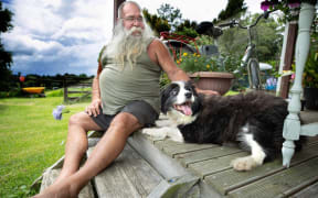 Paul Gibbs and Molly, who has recovered after been attacked by two dogs.