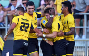 Hurricanes players celebrate a try during the round two Super Rugby Pacific match between Hurricanes and Fijian Drua at McLean Park.