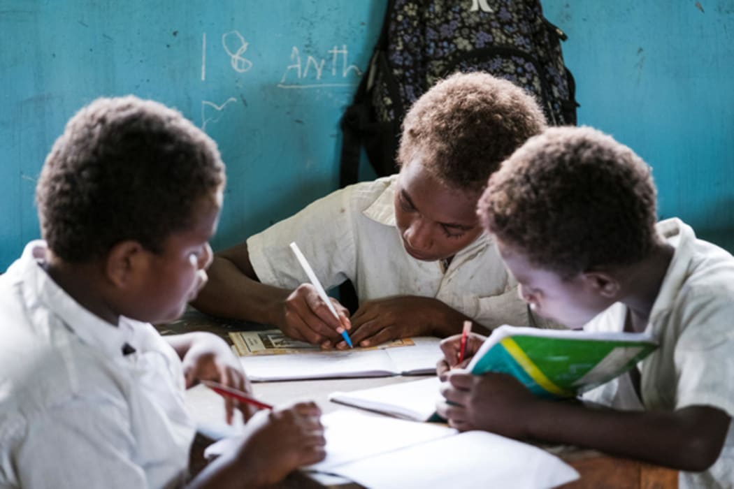 Grade three students hard at work during an English lesson at Nguvia Primary School near Honiara, Solomon Islands.