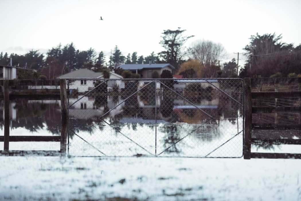 Floodwaters surround a farmhouse in mid Canterbury