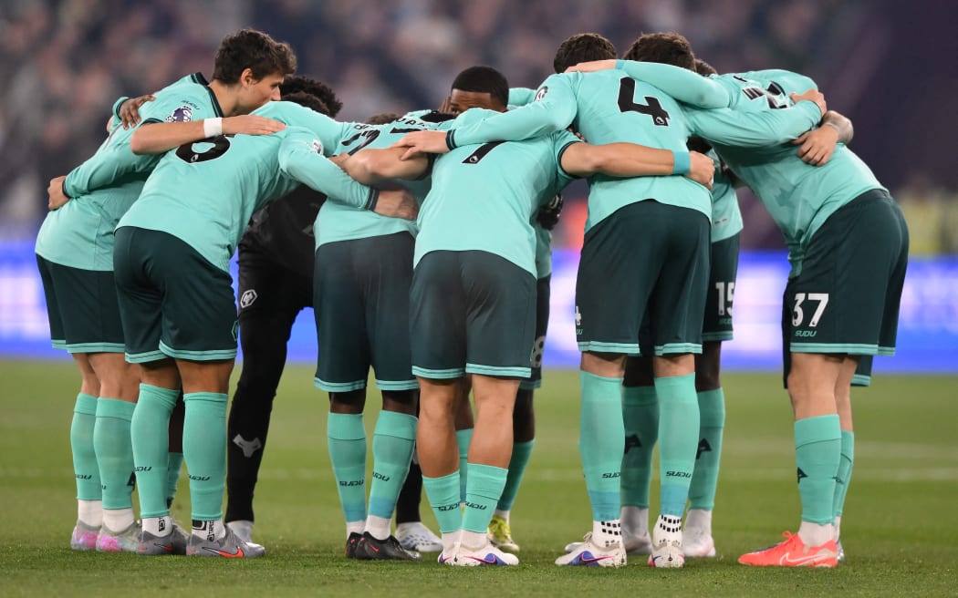 Wolverhampton Wanderers team huddle.