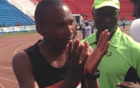 Runner Julius Ngoju argues his case after allegedly joining the marathon just 1km from the finish.