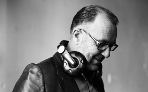 Peter Urlich wearing headphones around his neck