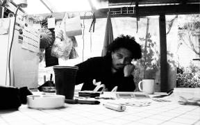 Diggy Dupé at home with a cup of tea.
