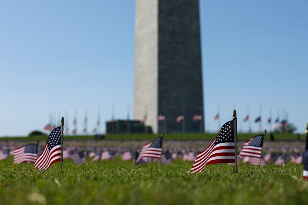 American flags placed on the National Mall by the Covid Memorial Project to represent the 200,000 Americans that have lost their lives due to the coronavirus.