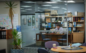 Josh Thomson as HR advisor Martin Katavake in his office