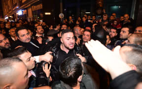 Turkish residents of the Netherlands gather for a protest outside Turkey's consulate in Rotterdam on March 11, 2017.