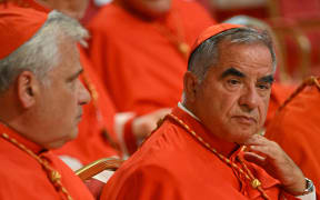 Italian Cardinal Giovanni Angelo Becciu, right, at St Peter's Basilica in The Vatican on 27 August, 2022.