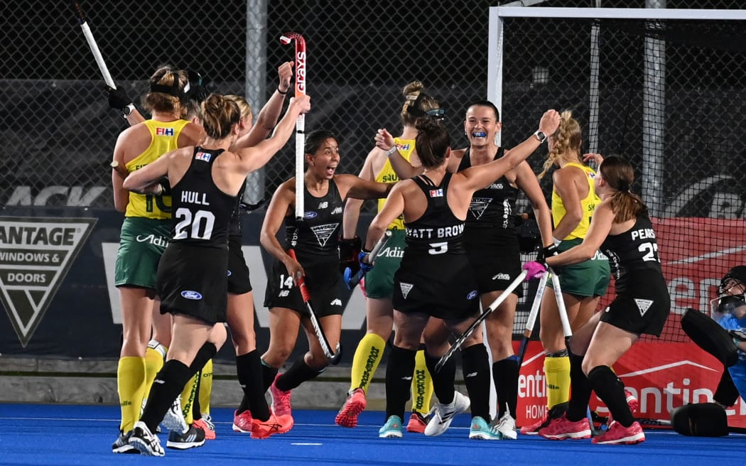 New Zealand women's hockey team celebrate Rose Tynan's goal against Australia, 2022 .