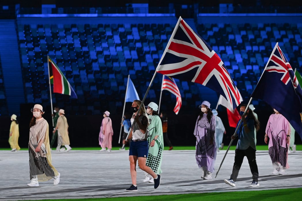 Britain's Laura Kenny carries her national flag during the closing ceremony of the Tokyo 2020 Olympic Games.