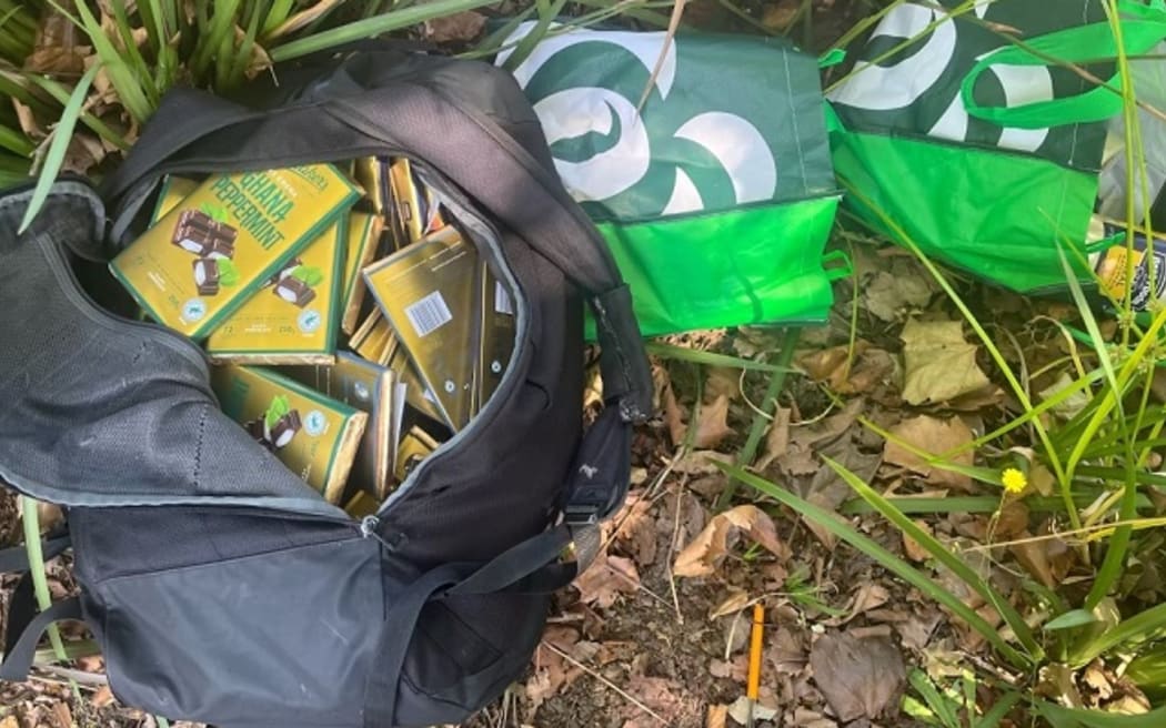 Police said three bags with stolen goods were found in a nearby bush.