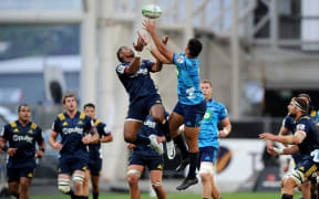Waisake Naholo of the Highlanders and Rieko Ioane of the Blues contest for the ball during the Super Rugby match between the Highlanders and the Blues.