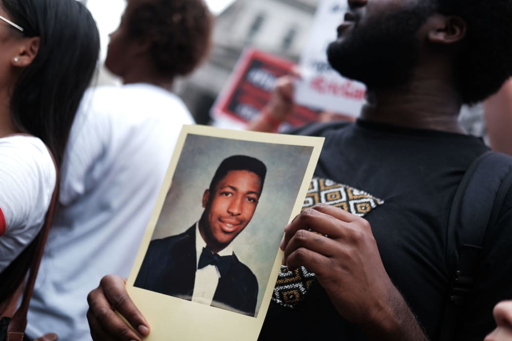 People protesting to mark the five year anniversary of Eric Garner's death.
